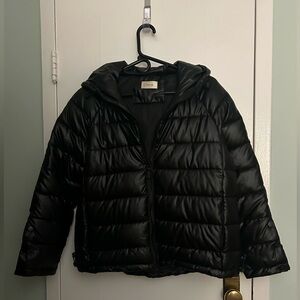 Black Puffer Jacket, with hood and zippered pockets.  Three snaps on sleeves.